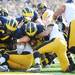 Michigan quarterback Devin Gardner carries the ball into the end zone for a touchdown against Iowa during the first quarter at Michigan Stadium. Melanie Maxwell I AnnArbor.com